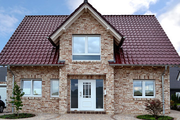 A single-family house covered with MONZA Trentino