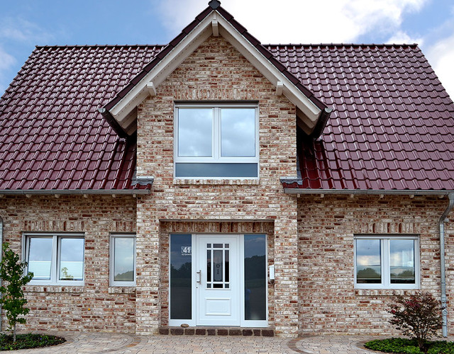 A single-family house covered with MONZA Trentino