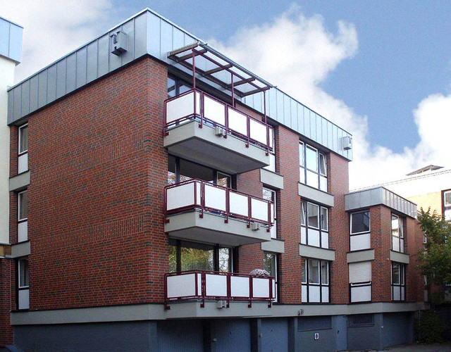 A residential building made of Westerwald shaded smooth brick