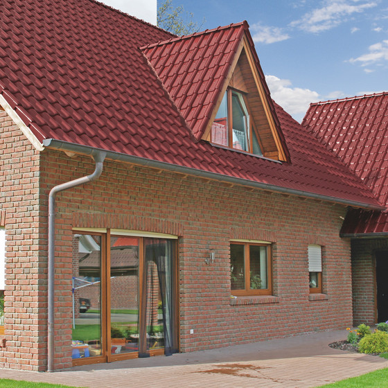 A single-family house covered with Piemont Trentino tile A single-family house covered with Piemont Trentino tile