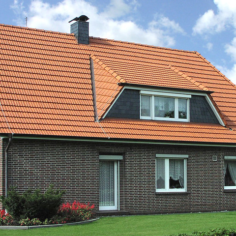 A single-family house covered with natural red Elsss tiles